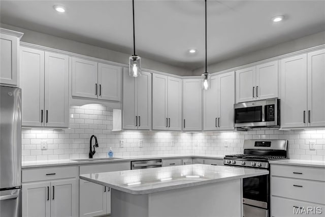 211 Cambium Ct, Wentzville, MO 63385 - kitchen featuring appliances with stainless steel finishes, white cabinets, decorative backsplash, and recessed lighting