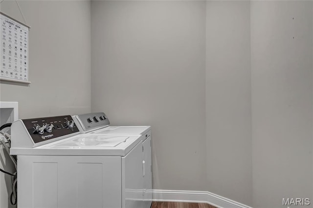 211 Cambium Ct, Wentzville, MO 63385 - laundry area with washer and clothes dryer and wood finished floors