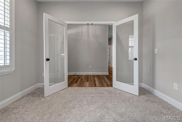 211 Cambium Ct, Wentzville, MO 63385 - unfurnished bedroom with french doors and carpet