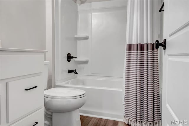 211 Cambium Ct, Wentzville, MO 63385 - bathroom featuring shower / bath combo with shower curtain and wood finished floors