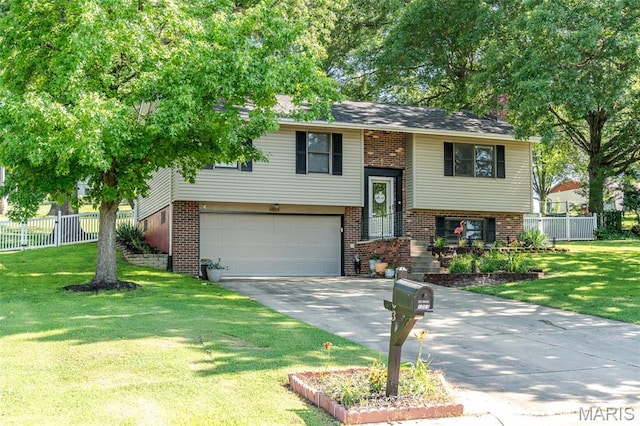 1003 Marilyn Ct, Washington, MO 63090 - bi-level home with a garage, driveway, and brick siding