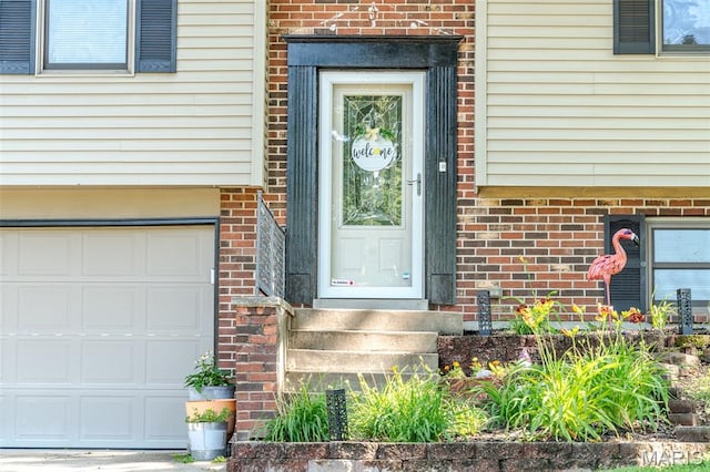 1003 Marilyn Ct, Washington, MO 63090 - view of exterior entry with brick siding and an attached garage