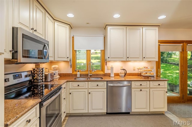 1003 Marilyn Ct, Washington, MO 63090 - kitchen with appliances with stainless steel finishes, light stone countertops, and recessed lighting