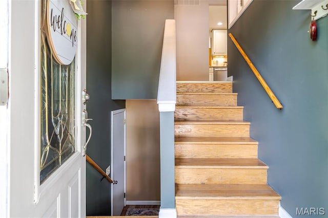 1003 Marilyn Ct, Washington, MO 63090 - stairs featuring baseboards