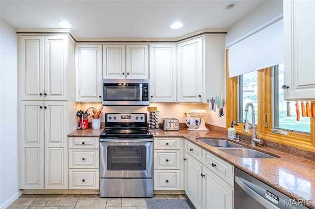 1003 Marilyn Ct, Washington, MO 63090 - kitchen featuring stainless steel appliances, light stone counters, white cabinetry, and recessed lighting