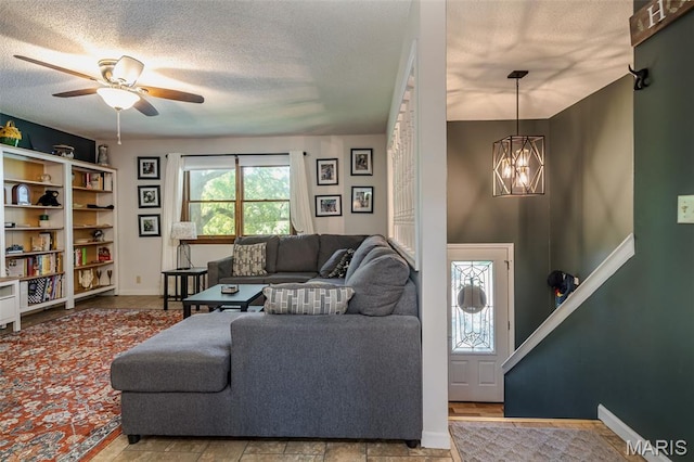 1003 Marilyn Ct, Washington, MO 63090 - living area with a chandelier, ceiling fan, and a textured ceiling