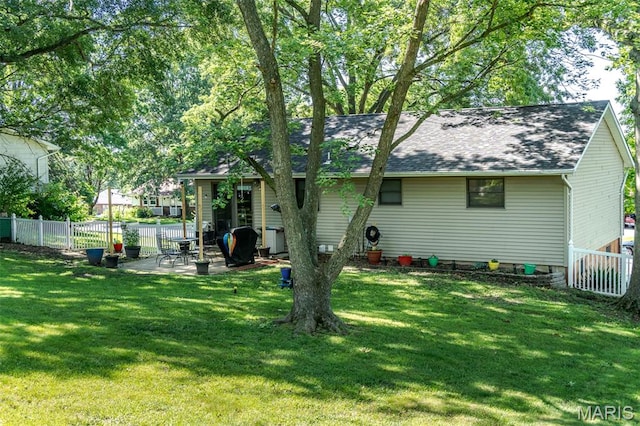 1003 Marilyn Ct, Washington, MO 63090 - rear view of house featuring a patio area, a fenced backyard, and roof with shingles