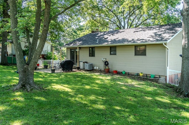 1003 Marilyn Ct, Washington, MO 63090 - rear view of house with a chimney, a patio area, and a shingled roof