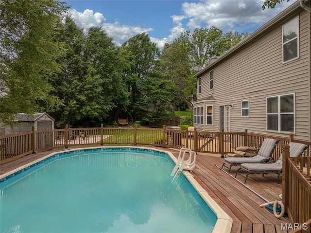 4 Green Circle Ct, Saint Peters, MO 63376 - view of swimming pool featuring a deck, a storage shed, and view of scattered trees