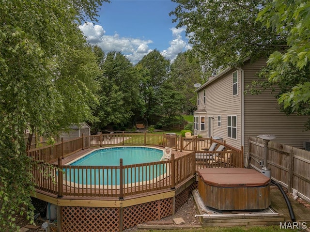 4 Green Circle Ct, Saint Peters, MO 63376 - view of pool featuring a hot tub, a wooden deck, and a fenced backyard