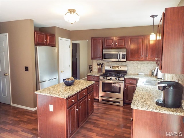 4 Green Circle Ct, Saint Peters, MO 63376 - kitchen with appliances with stainless steel finishes, dark wood finished floors, and backsplash