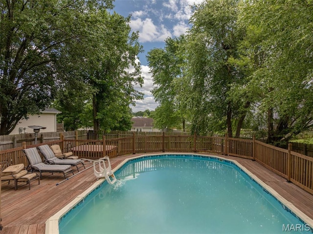 4 Green Circle Ct, Saint Peters, MO 63376 - view of swimming pool featuring a deck and a fenced backyard