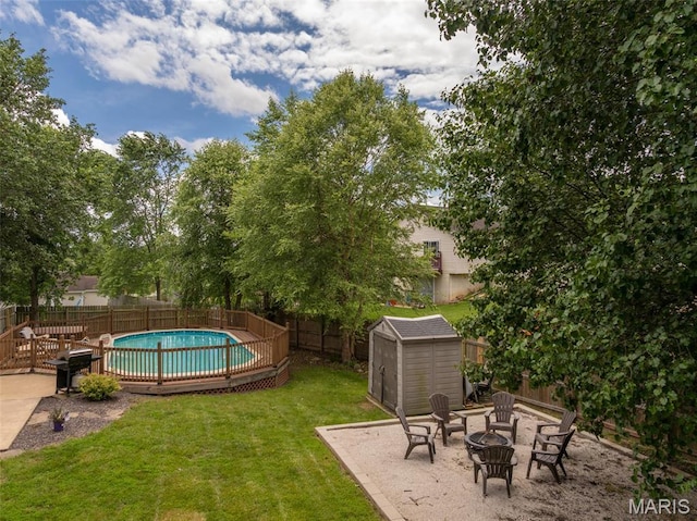 4 Green Circle Ct, Saint Peters, MO 63376 - fenced backyard featuring a storage unit, an outdoor fire pit, and a patio