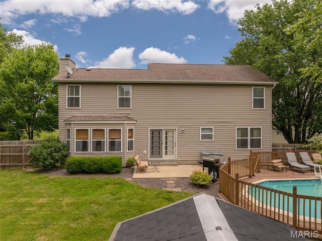 4 Green Circle Ct, Saint Peters, MO 63376 - back of property with a chimney and a patio area