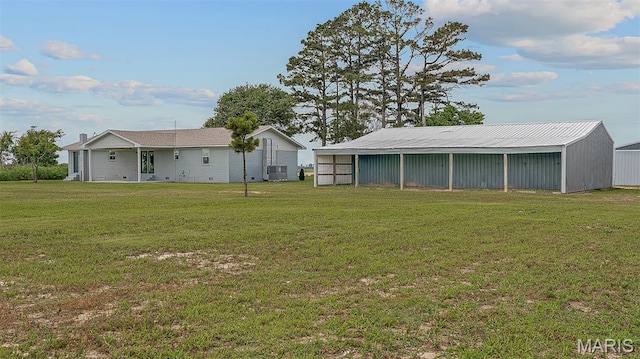 3120 State Highway F, Cardwell, MO 63829 - view of grassy yard featuring an outbuilding