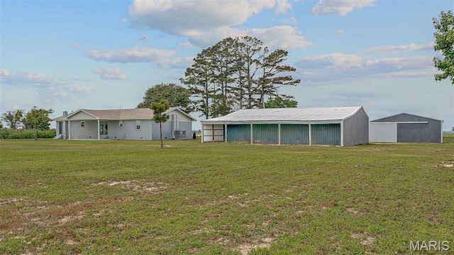 3120 State Highway F, Cardwell, MO 63829 - view of grassy yard with a pole building and an outdoor structure