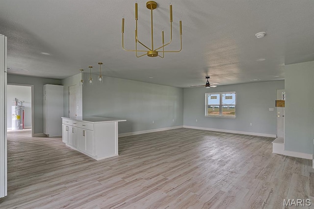 3120 State Highway F, Cardwell, MO 63829 - unfurnished living room with light wood-style flooring, a ceiling fan, water heater, a textured ceiling, and a chandelier