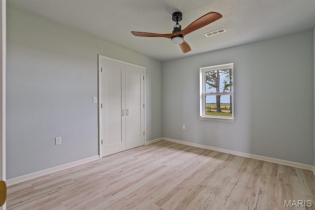 3120 State Highway F, Cardwell, MO 63829 - unfurnished bedroom featuring light wood-style floors, a closet, and ceiling fan