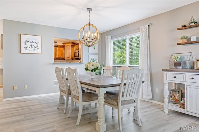 404 Arbor Spring Dr, Ballwin, MO 63021 - dining room featuring a chandelier and light wood-style floors