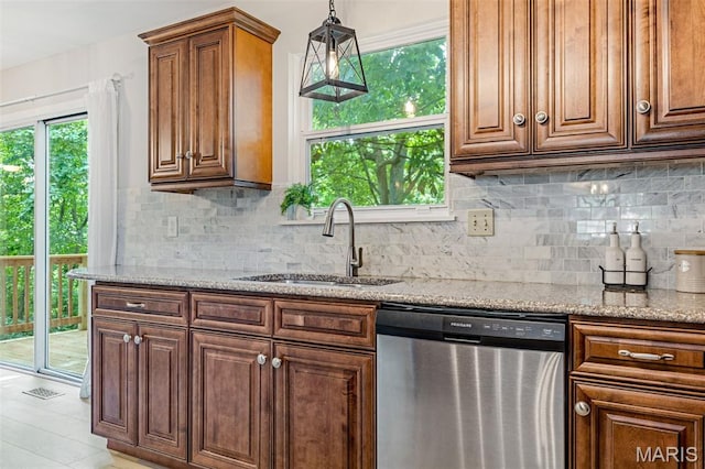 404 Arbor Spring Dr, Ballwin, MO 63021 - kitchen featuring dishwasher, tasteful backsplash, light stone countertops, and hanging light fixtures