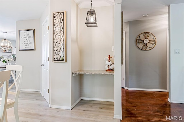 404 Arbor Spring Dr, Ballwin, MO 63021 - hall with a chandelier and light wood-style flooring