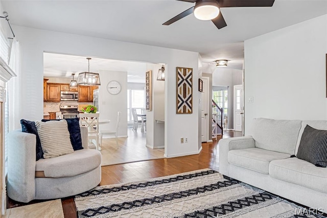 404 Arbor Spring Dr, Ballwin, MO 63021 - living area featuring ceiling fan and light wood-style floors