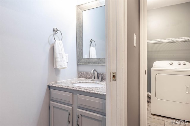 404 Arbor Spring Dr, Ballwin, MO 63021 - bathroom with washer / dryer and vanity