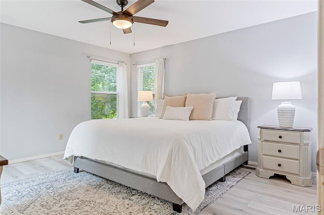 404 Arbor Spring Dr, Ballwin, MO 63021 - bedroom with light wood-style floors and ceiling fan
