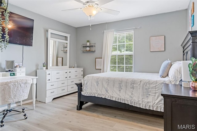 404 Arbor Spring Dr, Ballwin, MO 63021 - bedroom with light wood finished floors and a ceiling fan