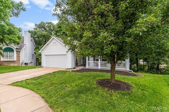 404 Arbor Spring Dr, Ballwin, MO 63021 - view of property hidden behind natural elements with concrete driveway, a garage, a front lawn, and covered porch