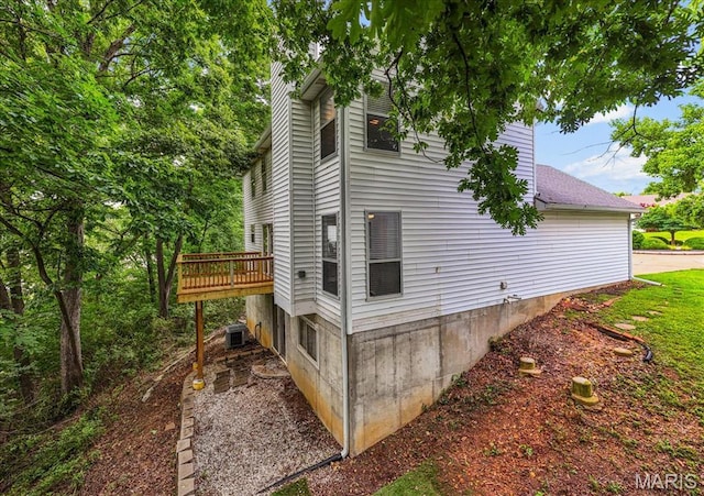 404 Arbor Spring Dr, Ballwin, MO 63021 - view of home's exterior with a deck and roof with shingles