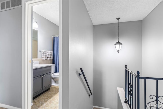 2318 Hidden Meadow Ln, Ballwin, MO 63021 - stairs with a textured ceiling