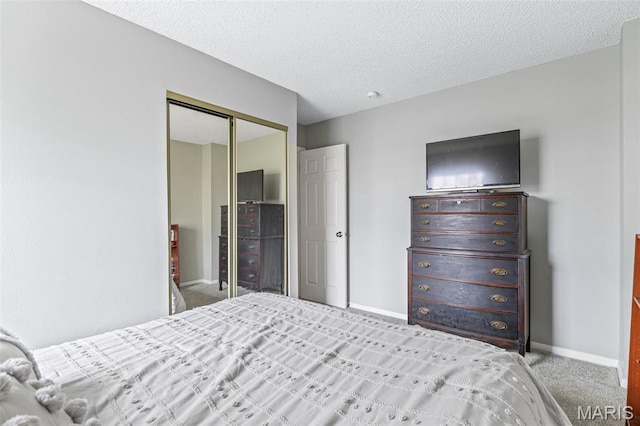 2318 Hidden Meadow Ln, Ballwin, MO 63021 - bedroom featuring carpet floors, a closet, and a textured ceiling