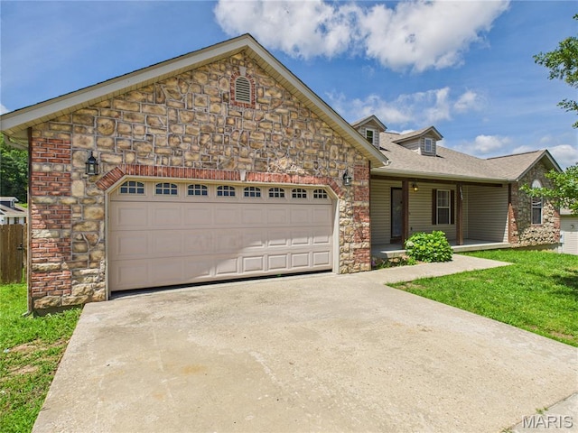 16107 Hummingbird Ln, Saint Robert, MO 65584 - view of front of house featuring stone siding, concrete driveway, a garage, roof with shingles, and a front yard