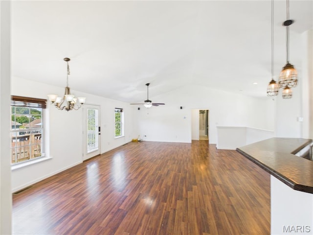 16107 Hummingbird Ln, Saint Robert, MO 65584 - unfurnished living room featuring a chandelier, lofted ceiling, dark wood-style flooring, and ceiling fan