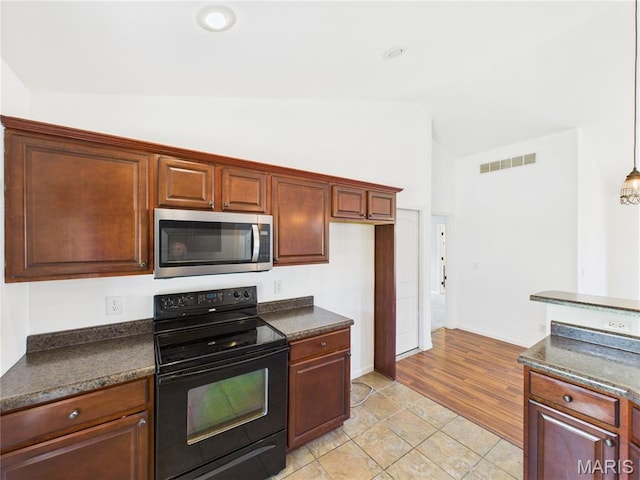 16107 Hummingbird Ln, Saint Robert, MO 65584 - kitchen with stainless steel microwave, black / electric stove, lofted ceiling, and dark countertops