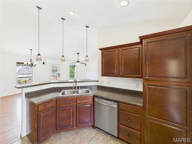16107 Hummingbird Ln, Saint Robert, MO 65584 - kitchen featuring dishwasher, lofted ceiling, dark countertops, a peninsula, and pendant lighting