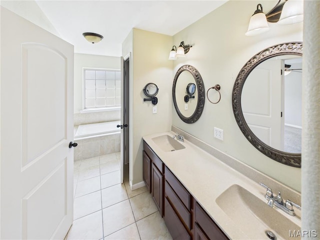 16107 Hummingbird Ln, Saint Robert, MO 65584 - full bathroom featuring tile patterned floors, a bath, double vanity, and a ceiling fan