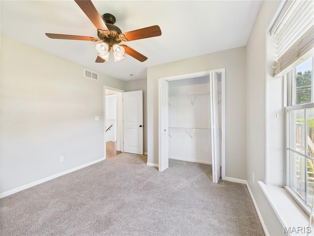 16107 Hummingbird Ln, Saint Robert, MO 65584 - unfurnished bedroom with carpet flooring, a closet, and a ceiling fan