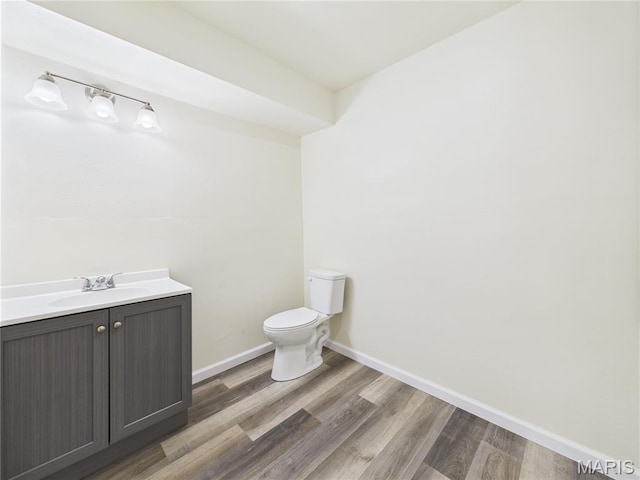 16107 Hummingbird Ln, Saint Robert, MO 65584 - half bath featuring vanity and wood finished floors