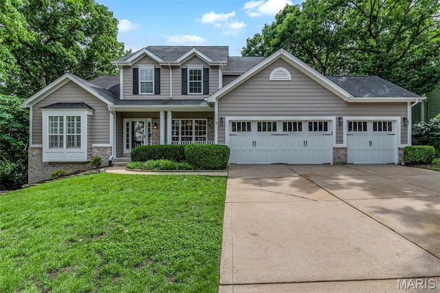 408 Bluff Meadow Dr, Ellisville, MO 63021 - view of front facade with concrete driveway, a garage, a front lawn, and stone siding