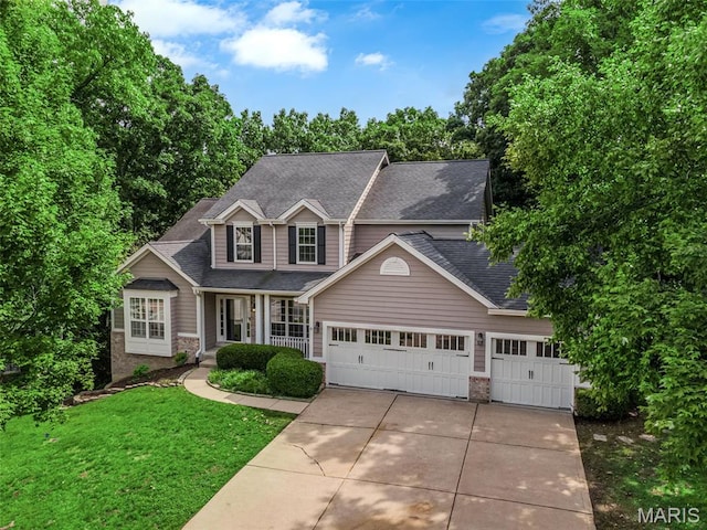 408 Bluff Meadow Dr, Ellisville, MO 63021 - view of front of property with concrete driveway, a front yard, a shingled roof, and a garage