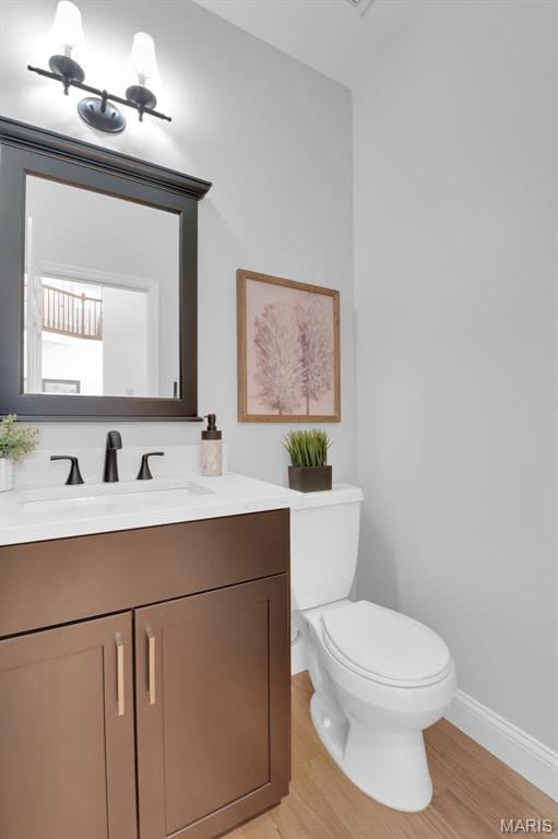 408 Bluff Meadow Dr, Ellisville, MO 63021 - half bath featuring vanity and wood finished floors