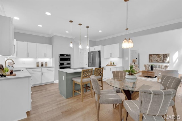 408 Bluff Meadow Dr, Ellisville, MO 63021 - dining room featuring ornamental molding, recessed lighting, light wood finished floors, and a chandelier