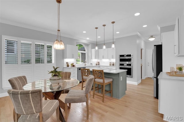 408 Bluff Meadow Dr, Ellisville, MO 63021 - dining area featuring crown molding, light wood finished floors, and recessed lighting
