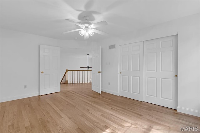 408 Bluff Meadow Dr, Ellisville, MO 63021 - unfurnished bedroom with light wood-type flooring, a ceiling fan, and a closet