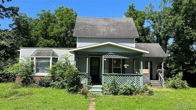 812 S Mine Ln, Motte, Fredericktown, MO 63645 - view of front facade featuring covered porch, a front lawn, and a shingled roof