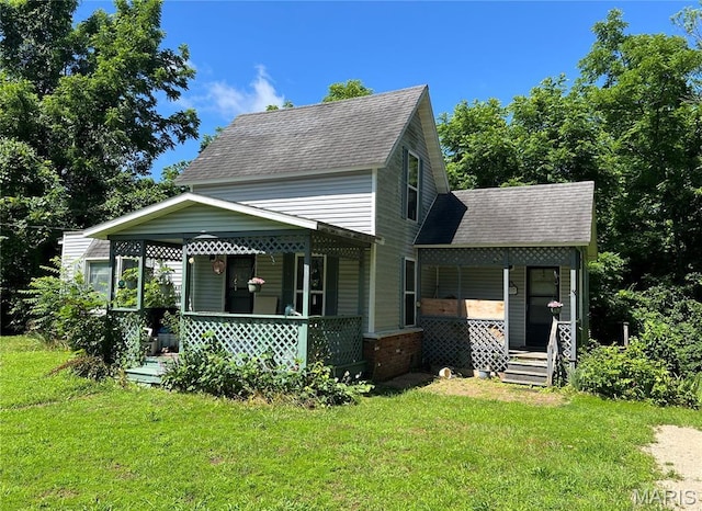 812 S Mine Ln, Motte, Fredericktown, MO 63645 - view of front facade with covered porch, roof with shingles, and a front yard