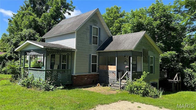 812 S Mine Ln, Motte, Fredericktown, MO 63645 - view of front of home with covered porch, a shingled roof, and a front yard