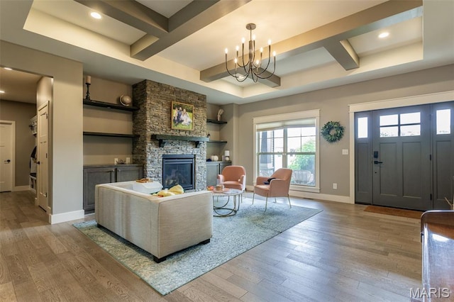 3841 Ember Ct, Edwardsville, IL 62025 - living room featuring wood-type flooring, coffered ceiling, a fireplace, recessed lighting, and a chandelier